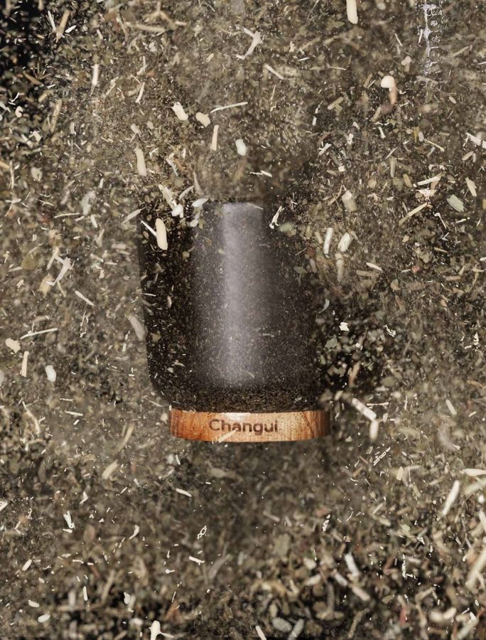 A Changüí mate standing in loose yerba mate dust